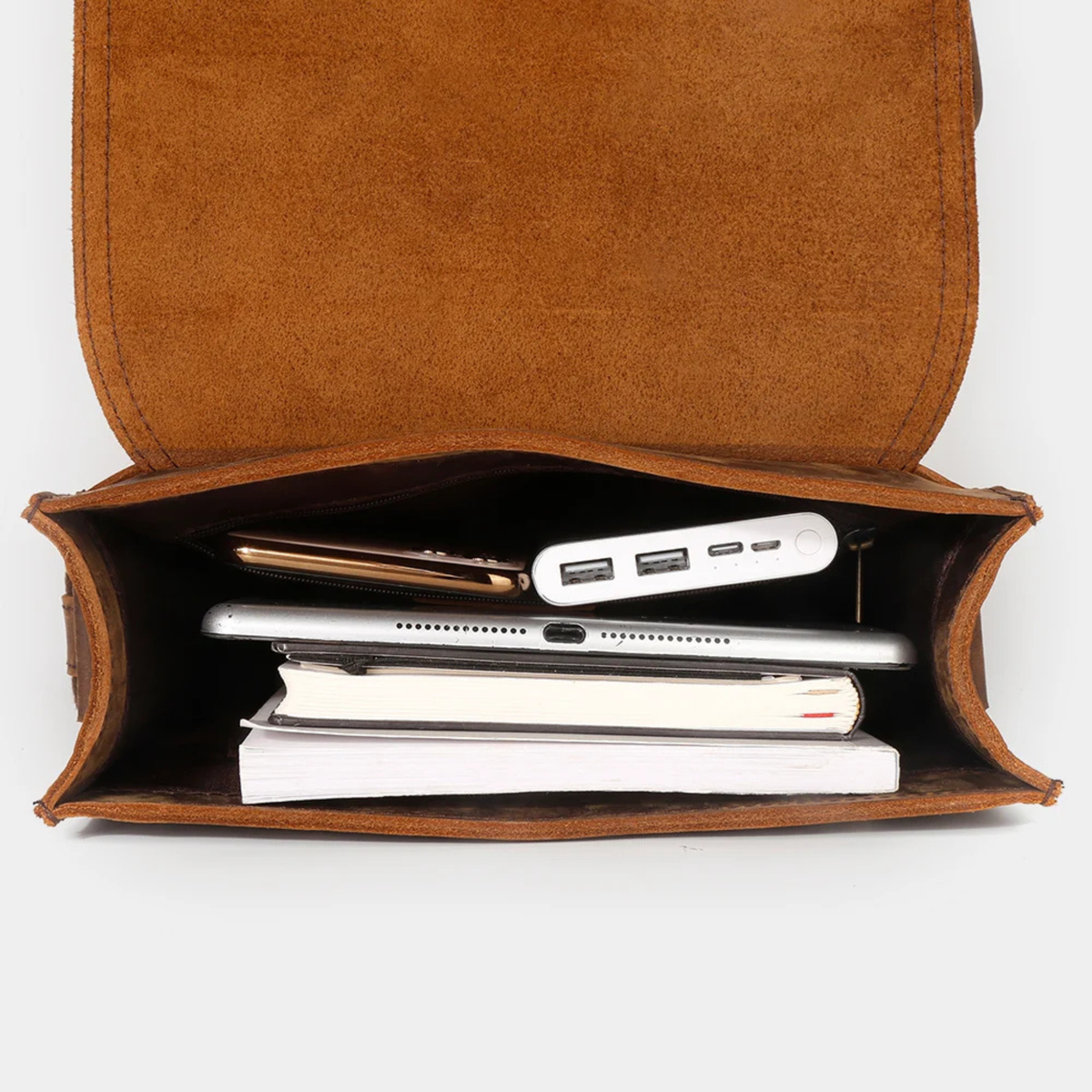 Brown leather crossbody bag interior with tablet storage