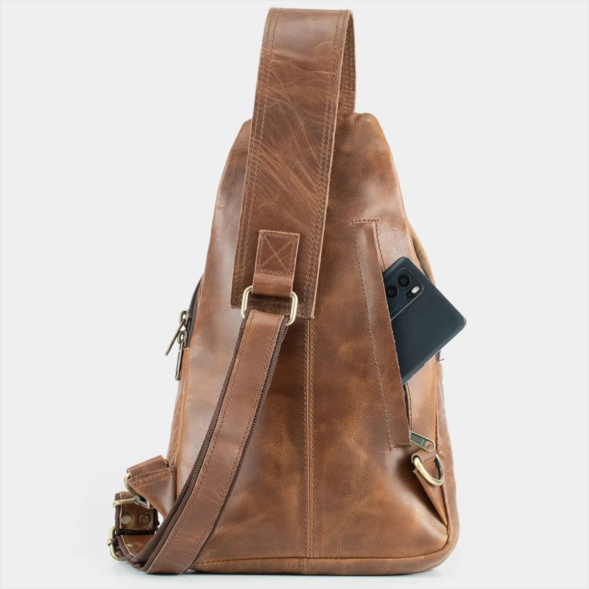 Light brown leather crossbody bag with adjustable shoulder strap