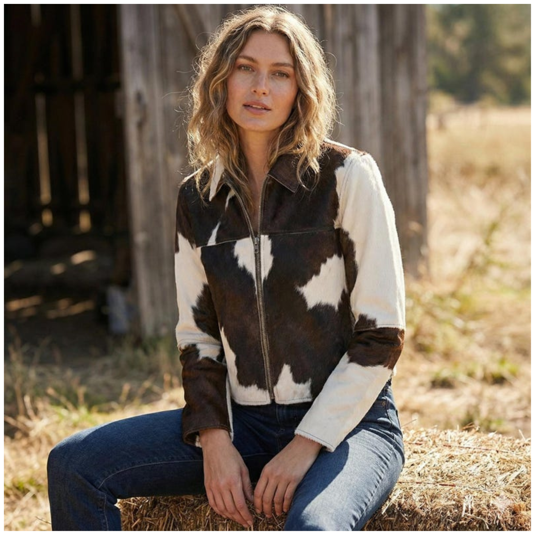 Woman wearing brown and white cowhide leather jacket street style
