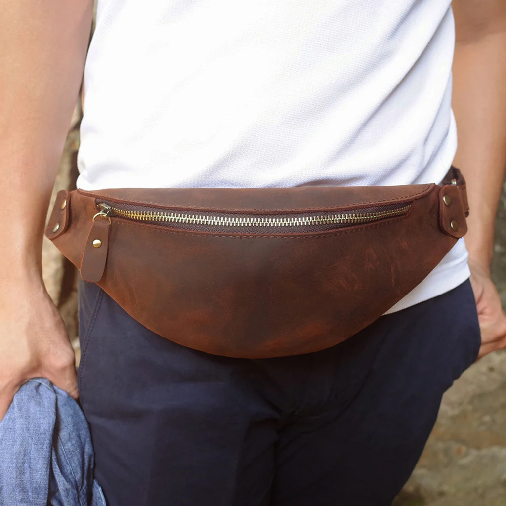 Dark brown leather waist bag worn around the waist