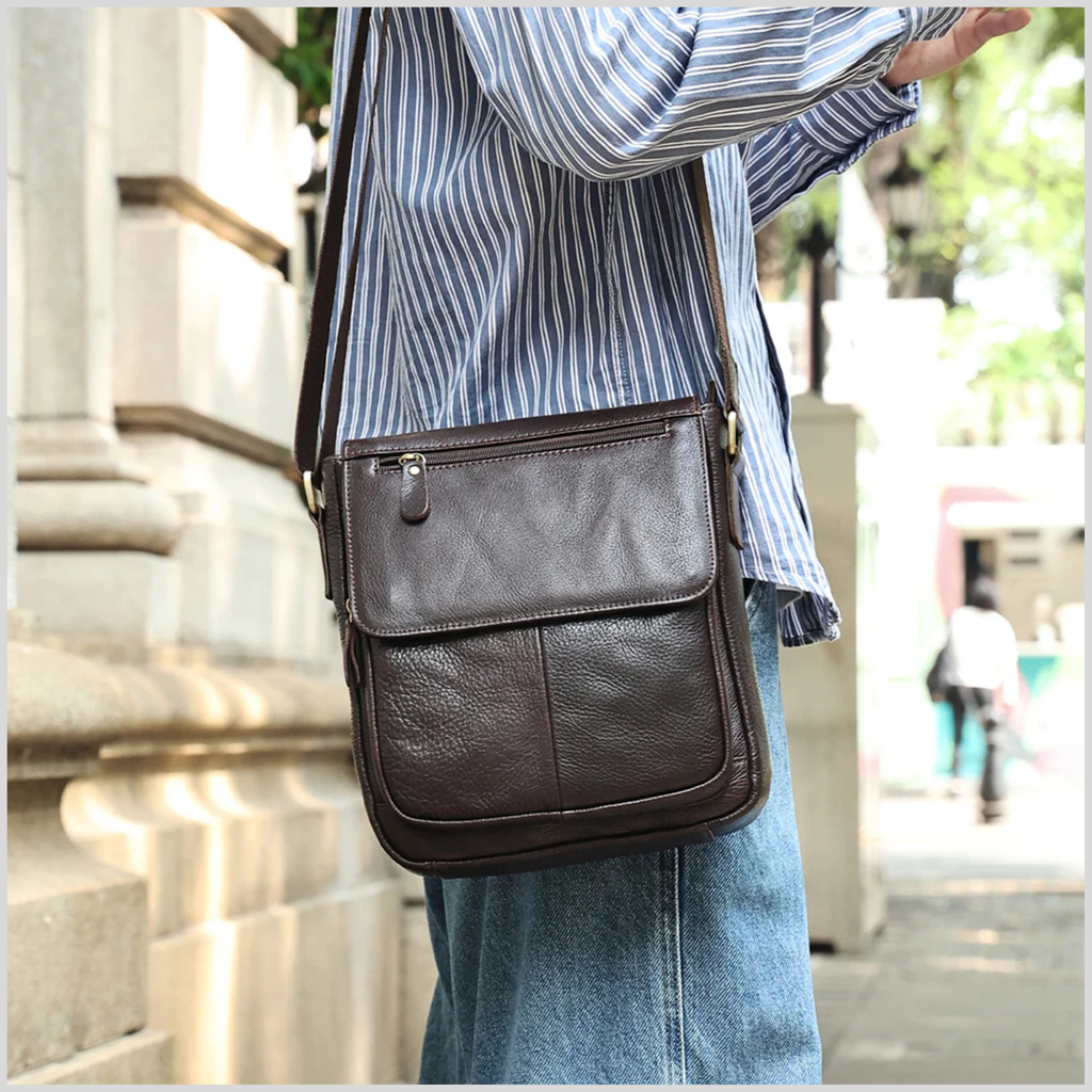 Dark brown cowhide leather crossbody bag worn over shoulder