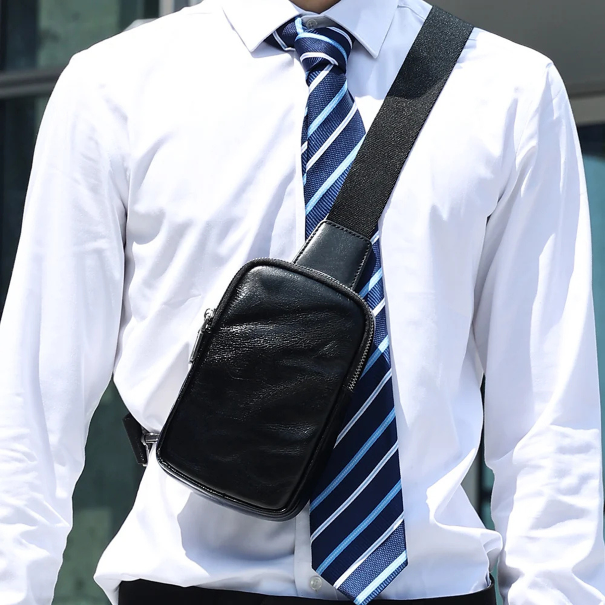 Black leather sling bag with adjustable shoulder strap