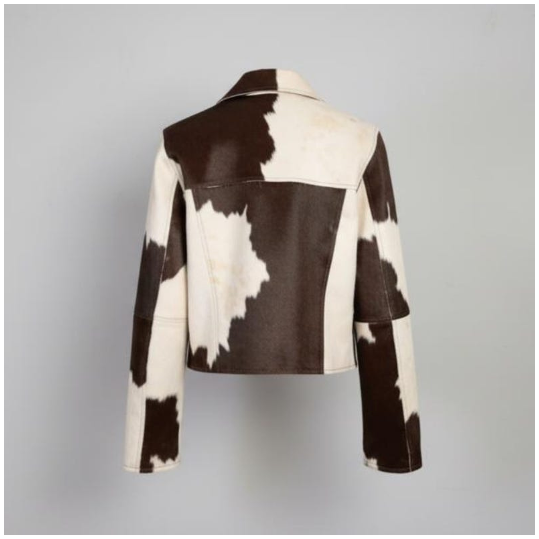 Back view of women brown & white cowhide leather jacket made from genuine leather with slim fit design